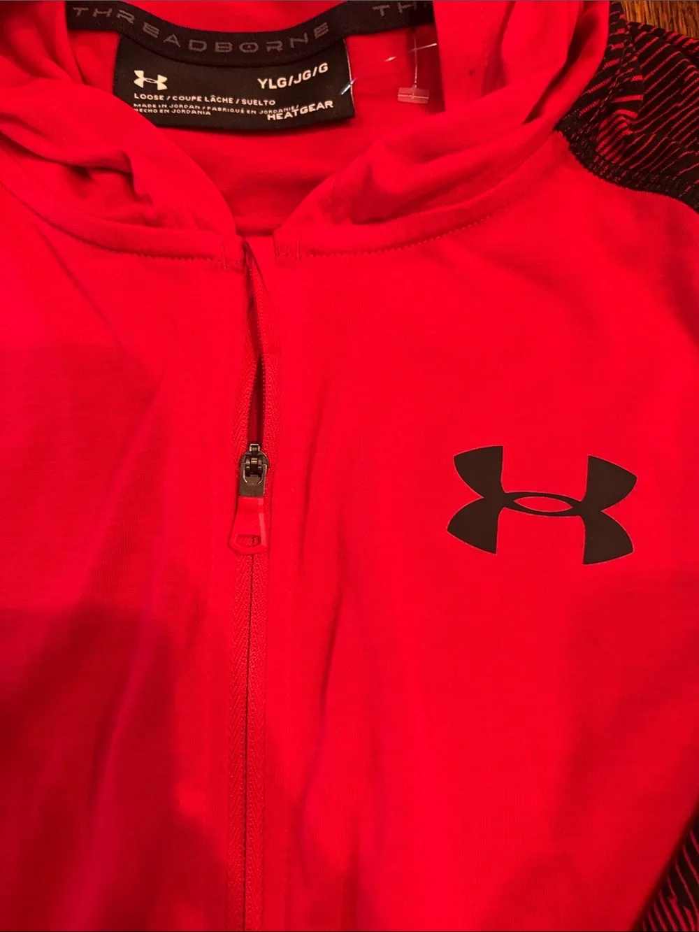 Under Armour. Long sleeve zip up with hood. Size large
